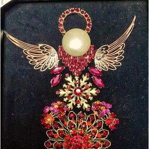 Angel Cynthia, she is done in gold and reds on black velvet